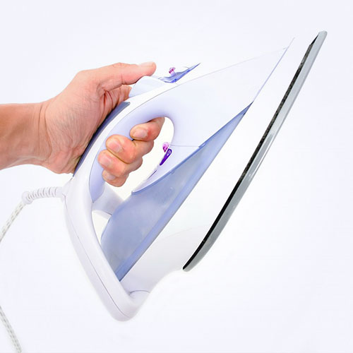 person holding an iron