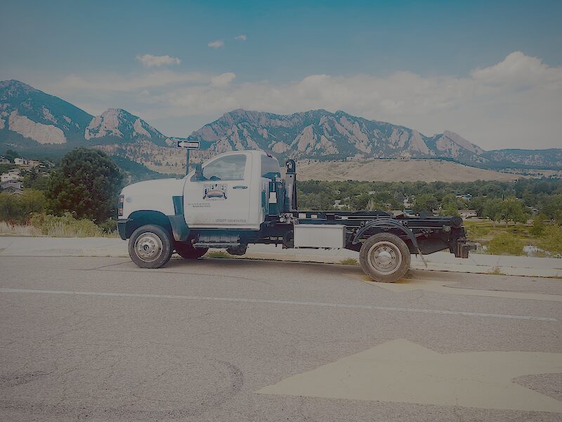 40 Yard Dumpster Rental in Denver, CO delivered beside a large renovation site with debris loading